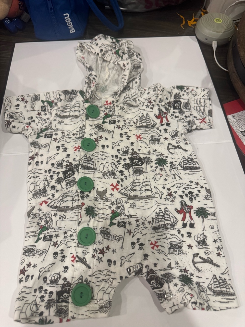 White Pirate-Print Hooded Baby Footie with Green Buttons